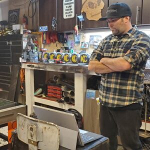 man operating a plasma cutter
