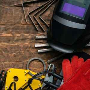 welding tools and gear on a desk