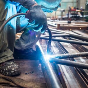 a person welding metal together