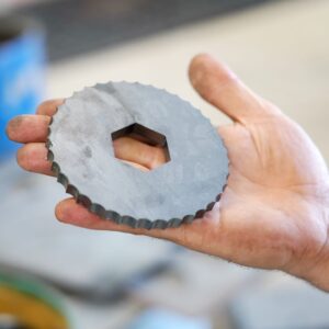 person holding metal circle