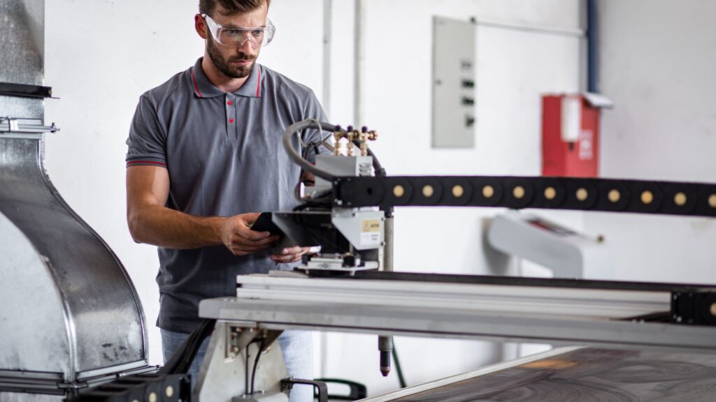 man using plasma cutter