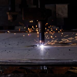plasma cutter cutting into sheet metal